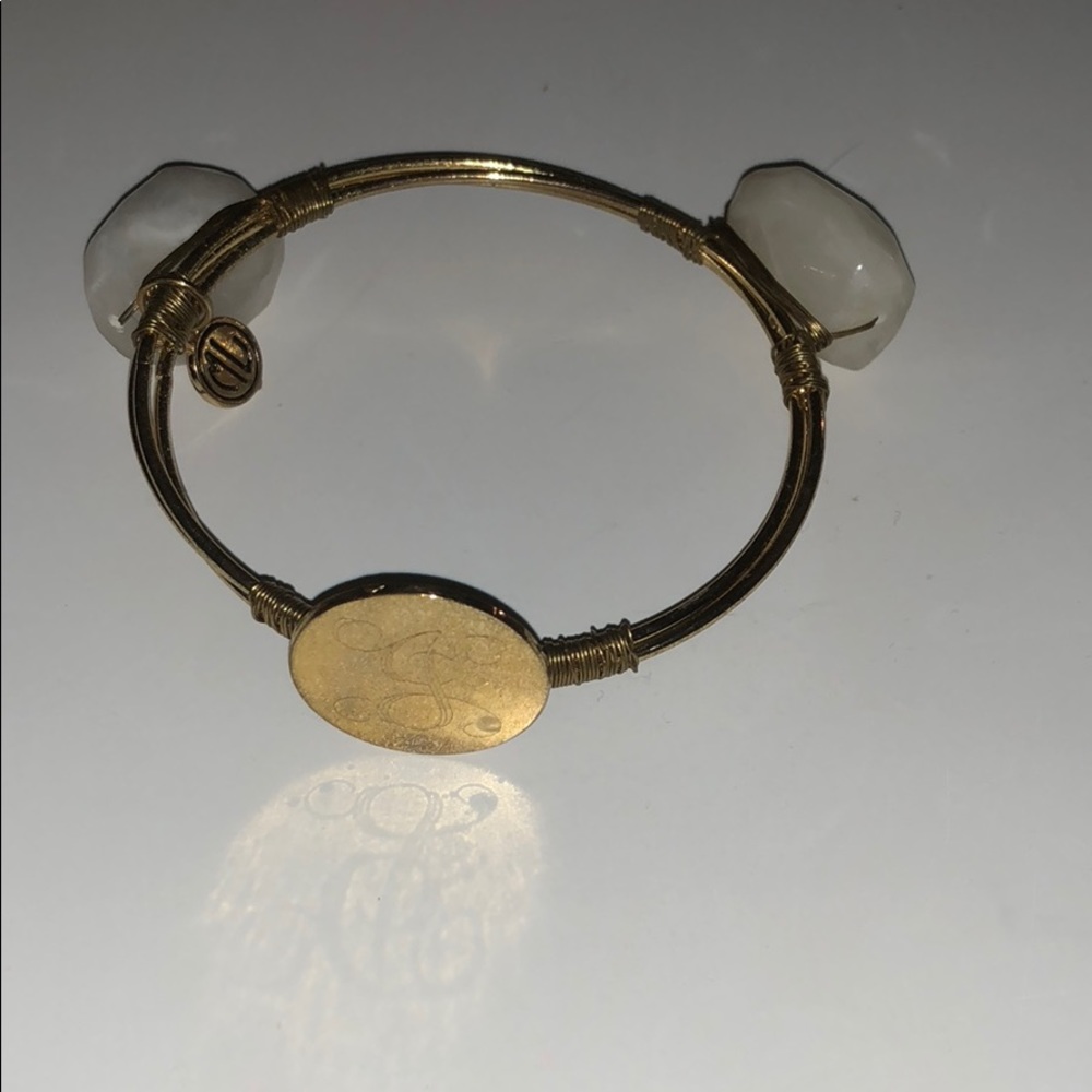 Gold J initialed bracelet with decorative rocks